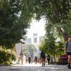 Students walking along Polett Walk with the Bell Tower in background