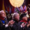 David Boardman and John Fry clapping at Commencement ceremony in regalia