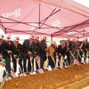 University leadership under a tent holding shovels for the groundbreaking ceremony for the new Caroline Kimmel Pavilion for Arts 